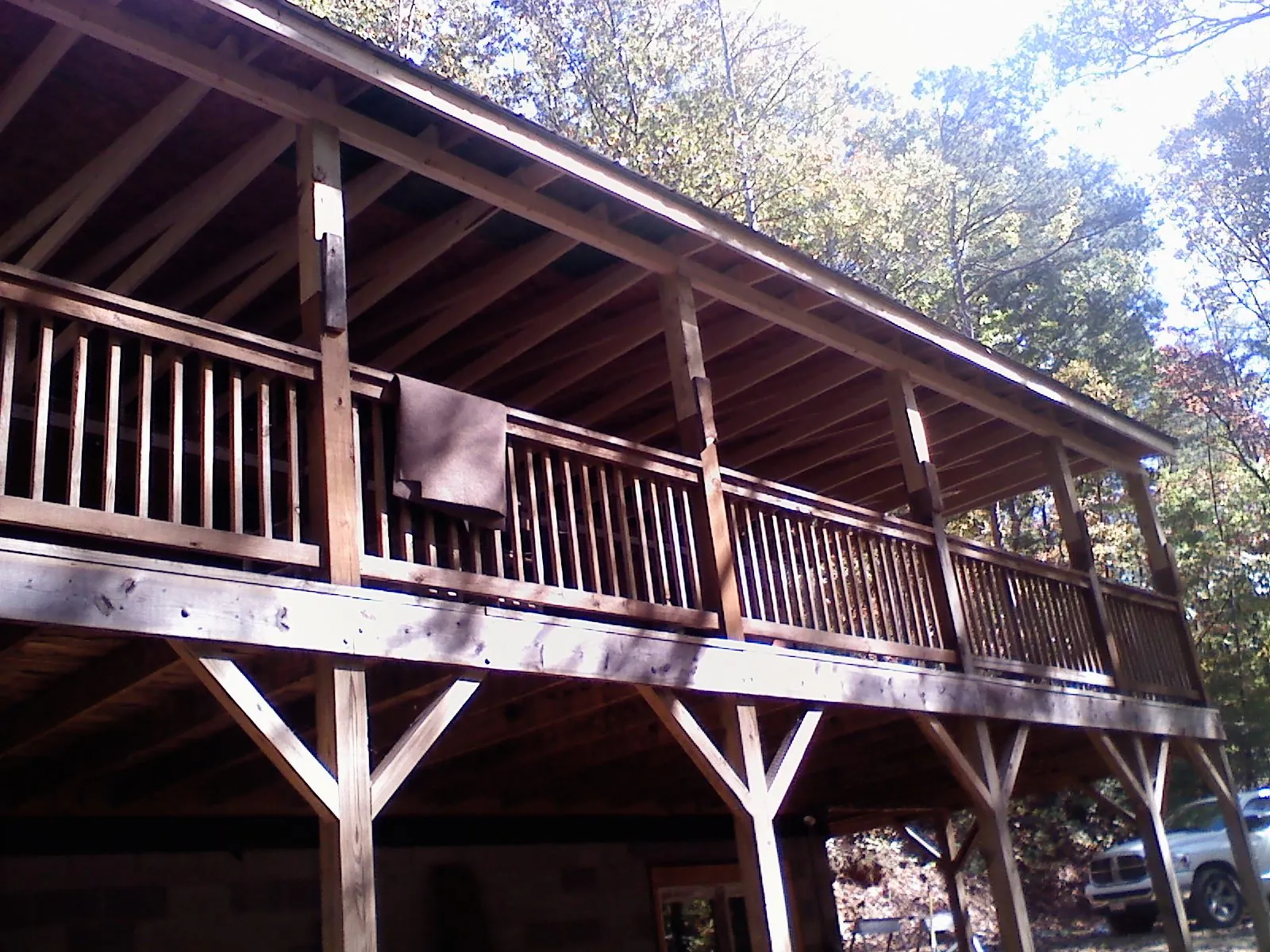 Timber framing under a new elevated porch and deck — Roof Leak Repair in Outlook by Roofing Brothers